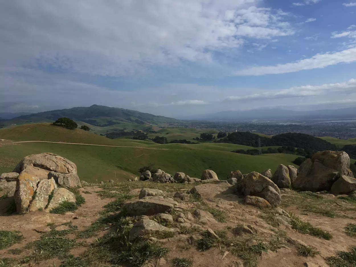 A rocky outcrop on Vargas Plateau offers views of gently rolling countryside and, far below, Fremont and Union City.